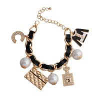 New Arrivals – Fresh, Trendy Fashion | – | Gold and Black Perfume Charm Bracelet - Modestly Vogue 