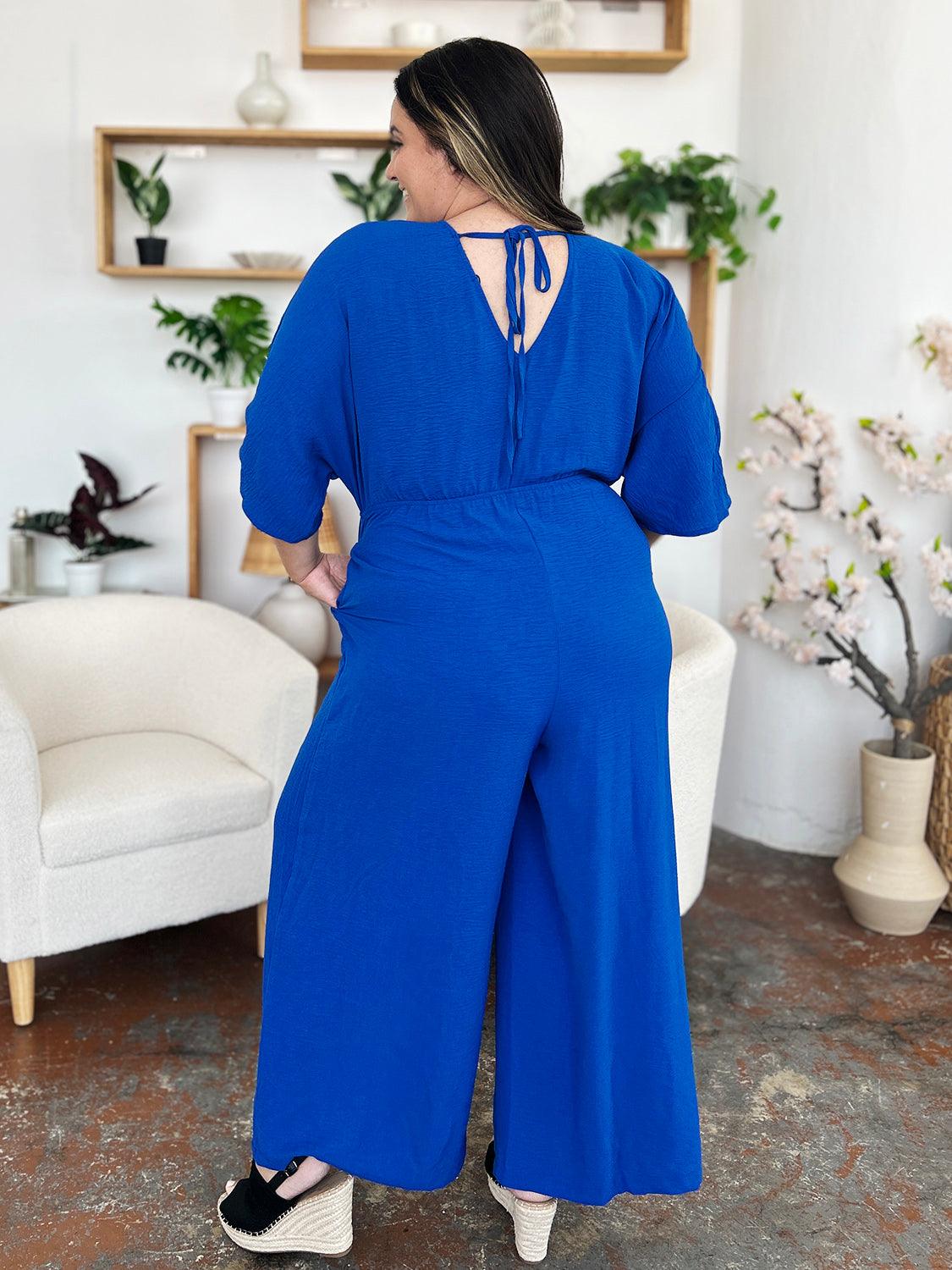 One-Piece Outfits for Every Occasion | Double Take Full Size Surplice Wide Leg Jumpsuit with Pockets - Modestly Vogue 