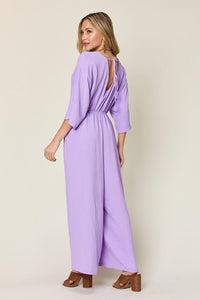 One-Piece Outfits for Every Occasion | Double Take Full Size Surplice Wide Leg Jumpsuit with Pockets - Modestly Vogue 