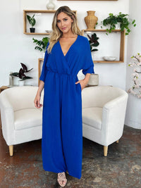 One-Piece Outfits for Every Occasion | Double Take Full Size Surplice Wide Leg Jumpsuit with Pockets - Modestly Vogue 