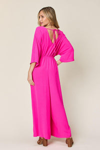 One-Piece Outfits for Every Occasion | Double Take Full Size Surplice Wide Leg Jumpsuit with Pockets - Modestly Vogue 