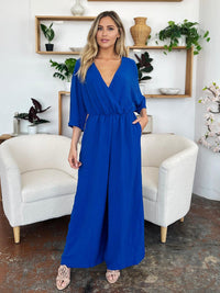 One-Piece Outfits for Every Occasion | Double Take Full Size Surplice Wide Leg Jumpsuit with Pockets - Modestly Vogue 