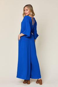 One-Piece Outfits for Every Occasion | Double Take Full Size Surplice Wide Leg Jumpsuit with Pockets - Modestly Vogue 